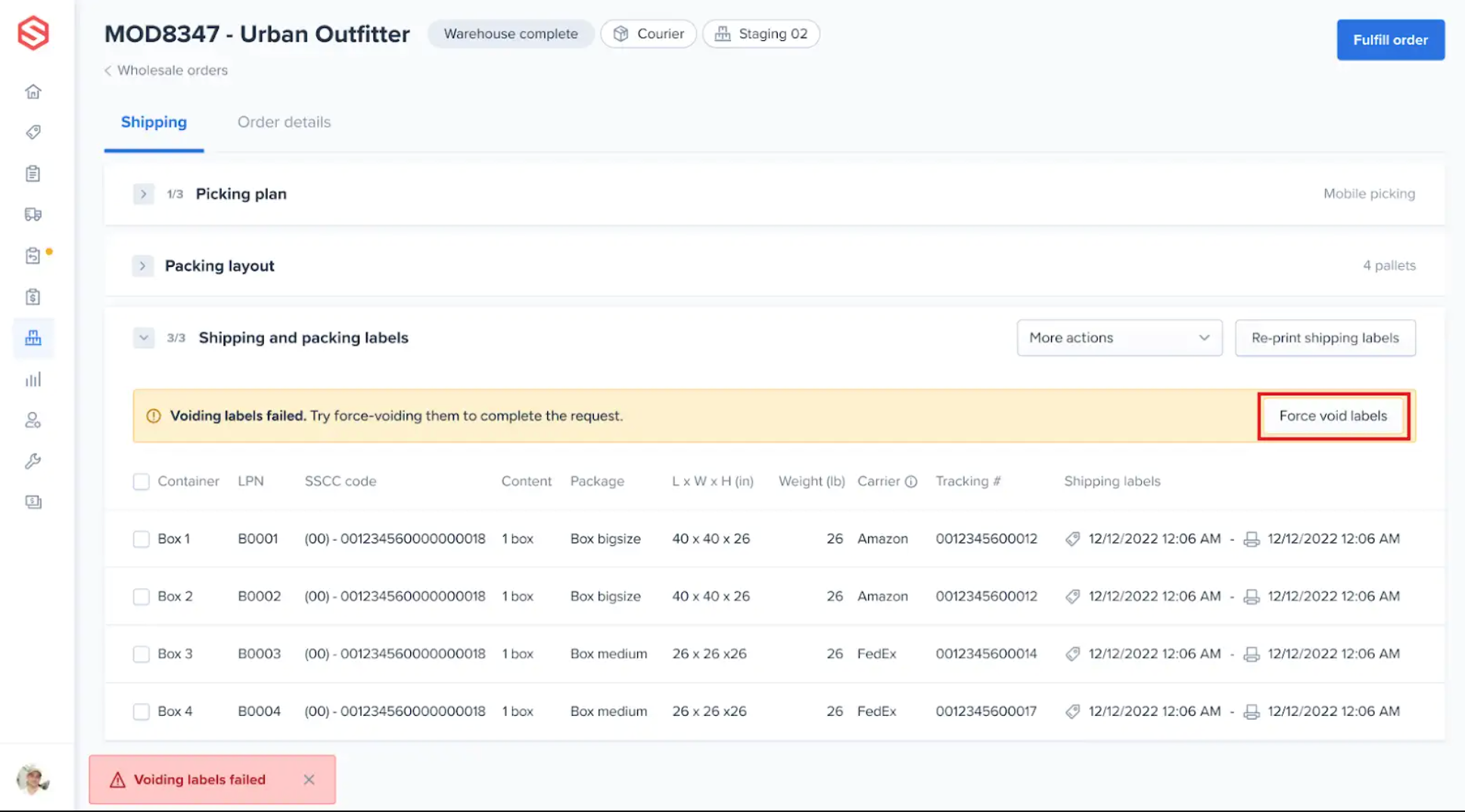 Shipping and packing labels section of a Courier wholesale order in the ShipHero Web Dashboard showing the Voiding labels failed message and the Force void labels button